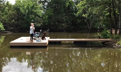 girl and dog on dock