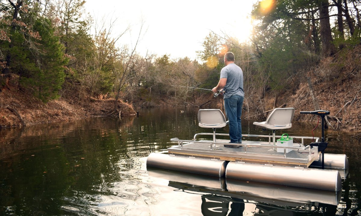 Man Fishing on Boat made from a DIY Boat Kit